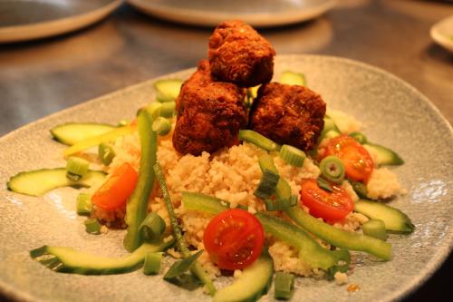 a plate of food with rice and meat and vegetables at The Bold Hotel; BW Signature Collection in Southport