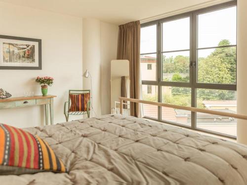 A bed or beds in a room at ATTICO DELLA LATTA
