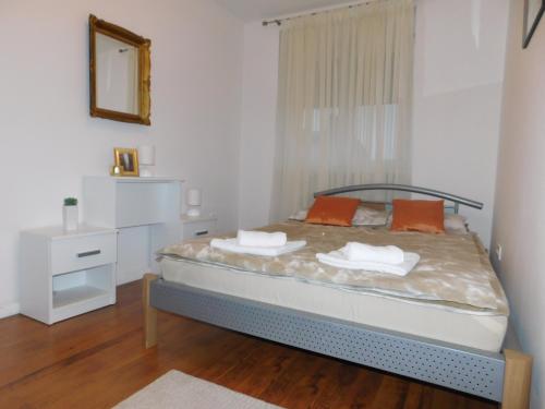 Postel nebo postele na pokoji v ubytování Apartman Ana
