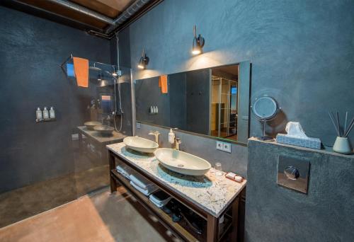 a bathroom with a sink and a mirror at 360 Hotel & Thermal Baths in Selfoss