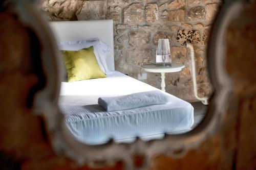 Ένα ή περισσότερα κρεβάτια σε δωμάτιο στο Borgo Alveria