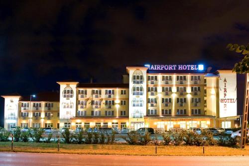 a large building with a lot of windows on the side of it at Airport Hotel Budapest in Vecsés
