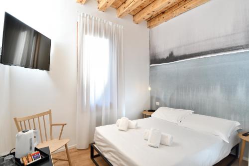 Postel nebo postele na pokoji v ubytování Hotel Rio