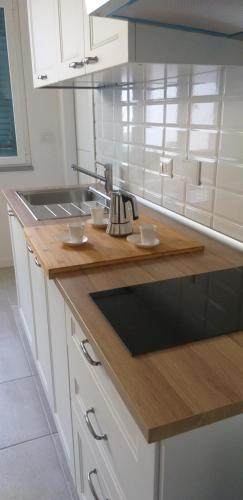 a kitchen with a counter with a tea kettle on it at Residenza Solferino in Corniglia
