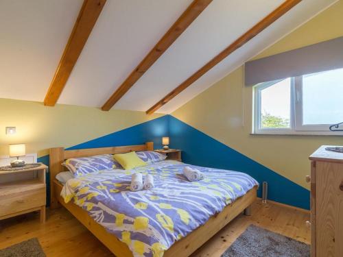 a bedroom with a bed with two teddy bears on it at House Toni for 8 persons in Briševo