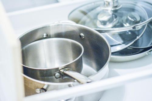 a bunch of pots and pans on a shelf at Il Mare appart hotel 1,2,4 in Luxembourg
