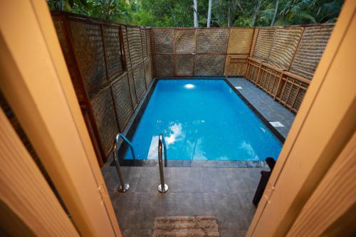 an overhead view of a swimming pool in a house at GoGo Land Resort & Adventurous Sports in Pūvār