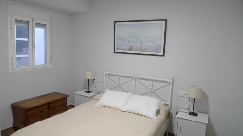 Postel nebo postele na pokoji v ubytování Living Triana House