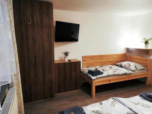 En eller flere senger på et rom på Apartmany De-Lu