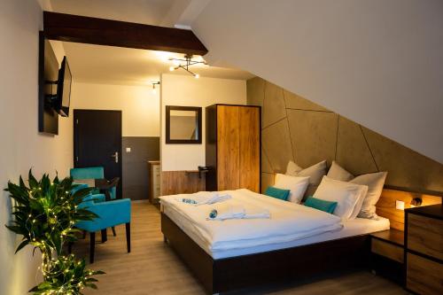En eller flere senge i et værelse på Apartmán Dagmar