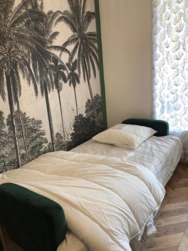 מיטה או מיטות בחדר ב-Les Palmiers de Gruissan, T2, Vue Port !