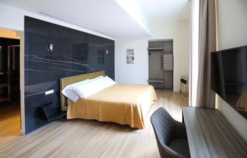 Lova arba lovos apgyvendinimo įstaigoje Municipio Luxury Suite