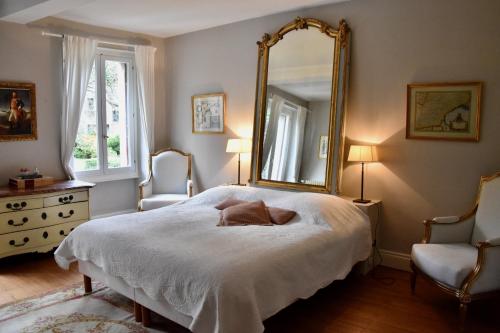 Säng eller sängar i ett rum på Residence le Petit Paradis