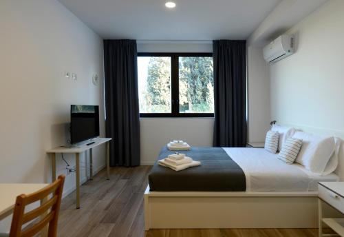 a bedroom with a large bed and a window at Agriturismo Tenuta Bettozza in Sasso Marconi