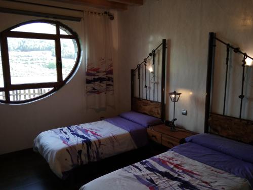 Postel nebo postele na pokoji v ubytování Casa Rural Ruralba