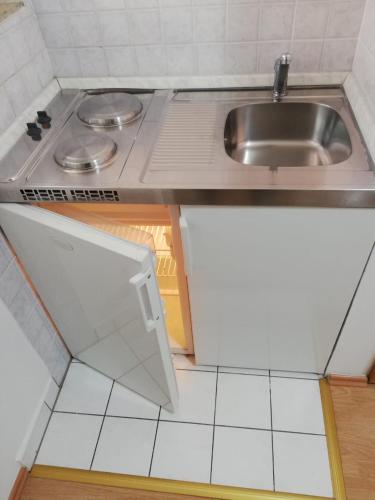a small kitchen with a sink and a counter at Studio za 2 osobe- LIJANA in Tučepi