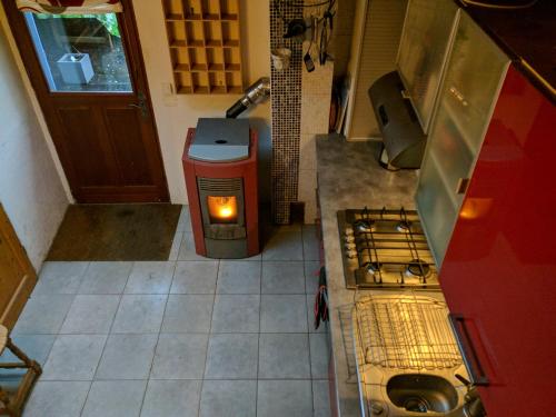 an overhead view of a kitchen with a stove top oven at The Bean Barn in Arçais