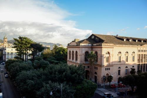 a large building on the side of a city street at AL TEATRO VERDI LUXURY APARTMENT in Salerno
