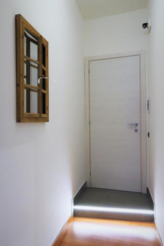 an empty room with a door and a window at Napoli Vesuvio Apartments by Dimorra in Naples