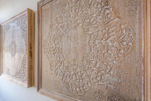 an ornate wooden wall with a decorative carving on it at Il bianconido in Castel Gandolfo