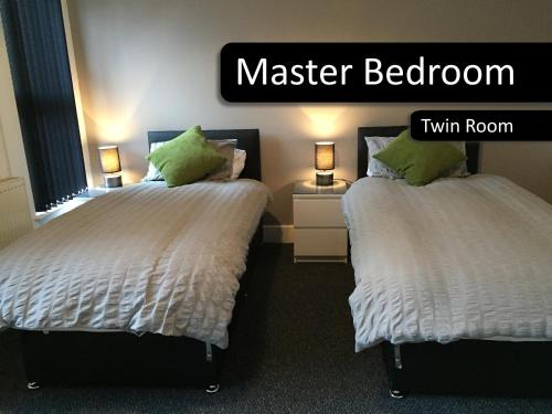 Katil atau katil-katil dalam bilik di Royle House by SG Property Group
