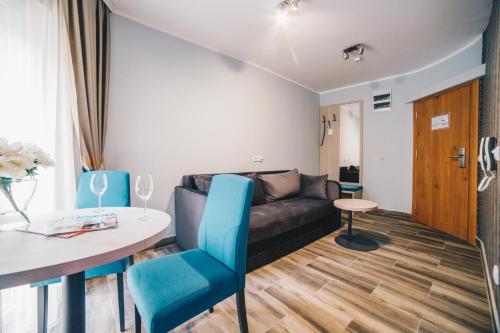 a living room with a couch and a table at Filips Sleep in Kragujevac