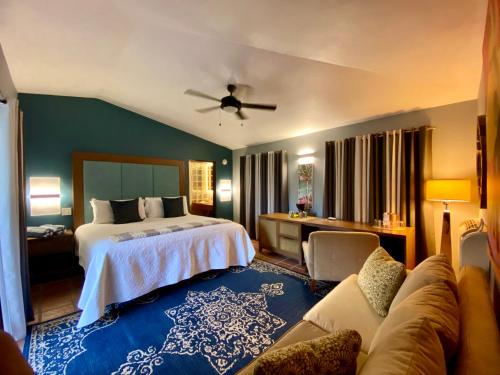a hotel room with a bed and a couch at Blue Horizon Boutique Resort in Vieques