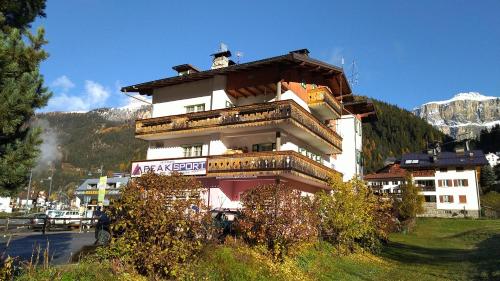 a large building in the middle of a mountain at Apartment Sellaronda Canazei in Canazei