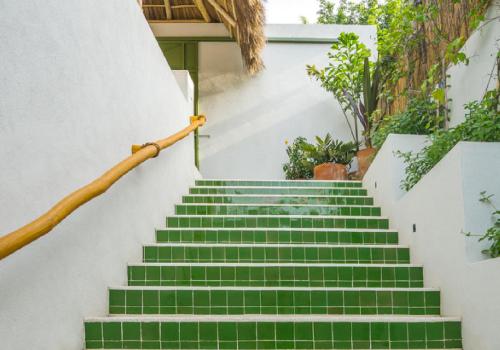a set of stairs with green tiles at Marii Hotel Boutique in San Francisco