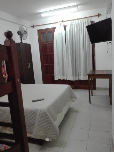 מיטה או מיטות בחדר ב-Apart Jujuy monoambiente