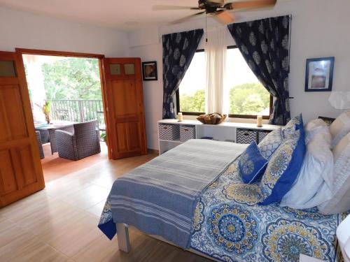 Ένα ή περισσότερα κρεβάτια σε δωμάτιο στο Casa Mia at Villa Camino Alto Turbaco near Cartagena