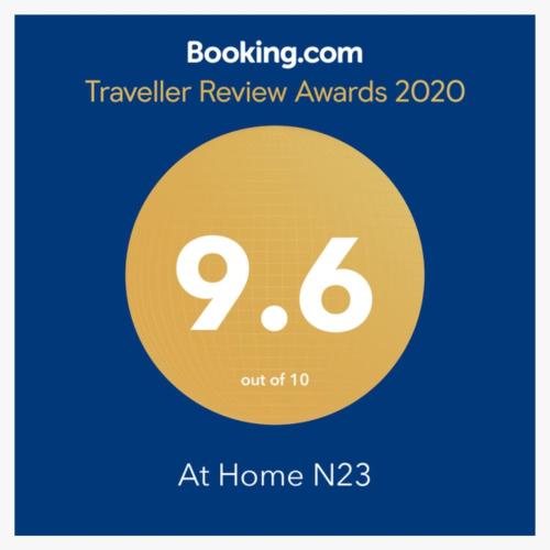 a sign that reads traveler review awards at home at At Home N23 in Sapporo