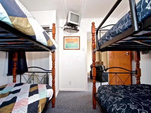 A bunk bed or bunk beds in a room at Irwin Bach - Ohakune Holiday Home