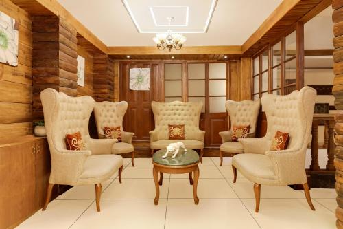 a waiting room with chairs and a table at Summit Hermon Hotel & Spa in Darjeeling