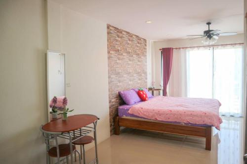Ein Bett oder Betten in einem Zimmer der Unterkunft Ingkho Khao Kho อิงค้อ เขาค้อ