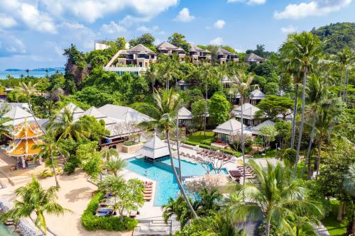 an aerial view of a resort with a pool and palm trees at Fair House Villas & Spa, Koh Samui in Mae Nam