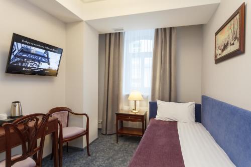 מיטה או מיטות בחדר ב-Medea Hotel