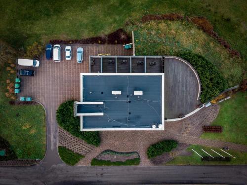 an overhead view of a large building with a parking lot at Kapteinu Osta in Salacgrīva