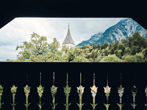 a view of a church from behind a fence at TAUROA Krenn in Pürgg