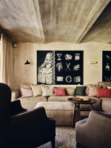 a living room with a couch and a table at TAUROA Krenn in Pürgg