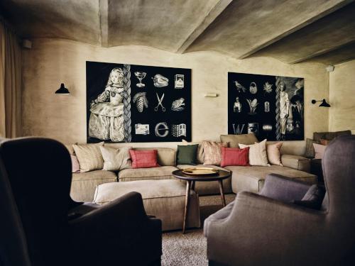 a living room with a couch and a table at TAUROA Krenn in Pürgg