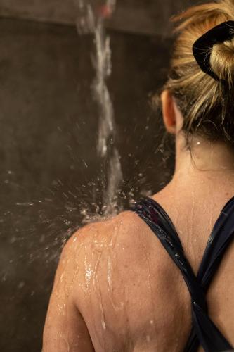 a woman in the water with her back to the camera at Hotel Arok in Strasbourg