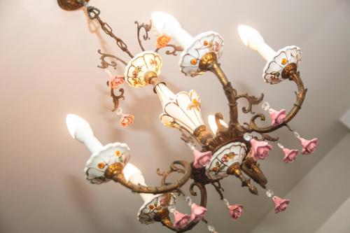 a chandelier with skulls and roses on it at See&Sun in Ashdod