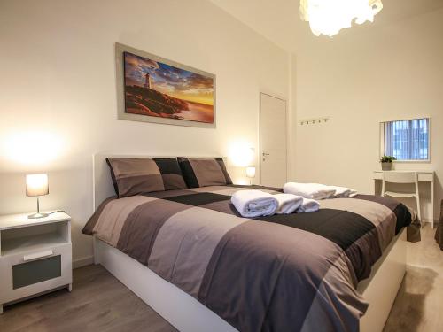 Posteľ alebo postele v izbe v ubytovaní ChilometroZERO luxury apartment