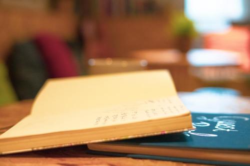 a book sitting on top of a table at Haystack Hostel in Edinburgh