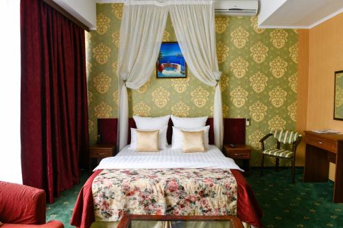 Кровать или кровати в номере Парк Отель Ставрополь