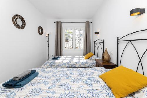 a bedroom with two beds and a window at EL ZAFIRO in Puerto del Carmen