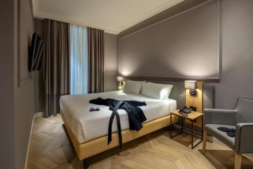 Un pat sau paturi într-o cameră la Best Western Hotel Astrid