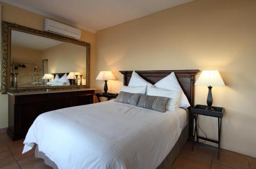 Ένα ή περισσότερα κρεβάτια σε δωμάτιο στο Kingston Place Guesthouse