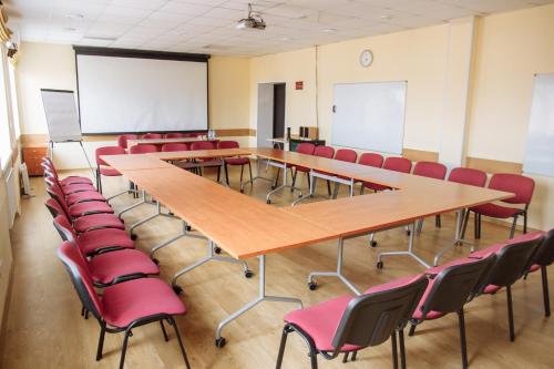 a conference room with a table and chairs at Optima Sumy in Sumy
